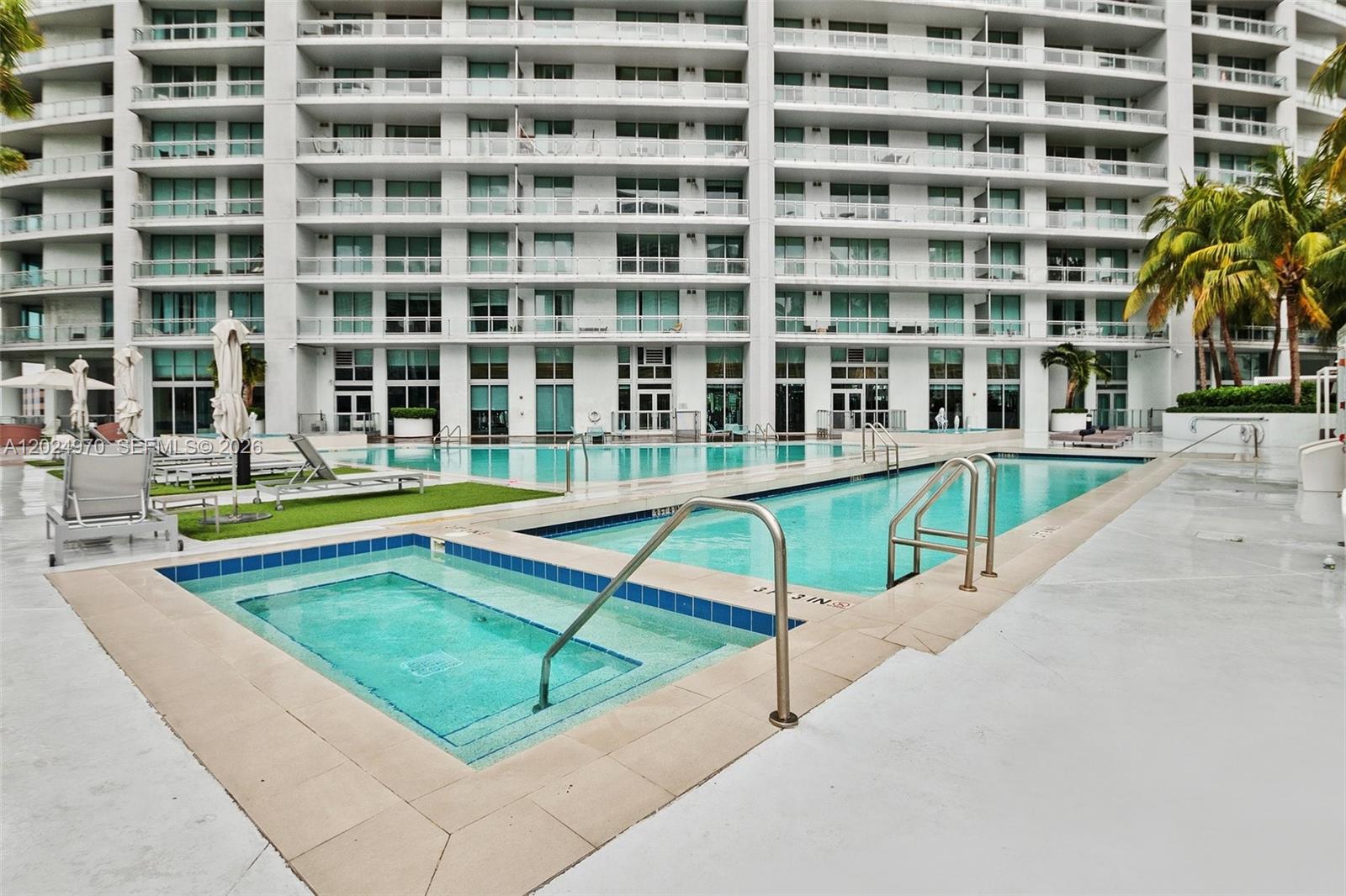 90 Southwest 3rd Street, Unit 3810 Miami, FL 33130 - Photo 32 of 45 a view of swimming pool with building in front of it