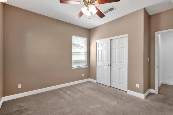 a kitchen with stainless steel appliances granite countertop a sink a stove and a counter space