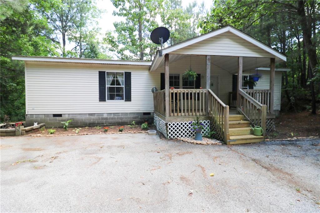 116 Hurst Mill Road Bremen, GA 30110 - Photo 1 of 1 a view of a house with a yard