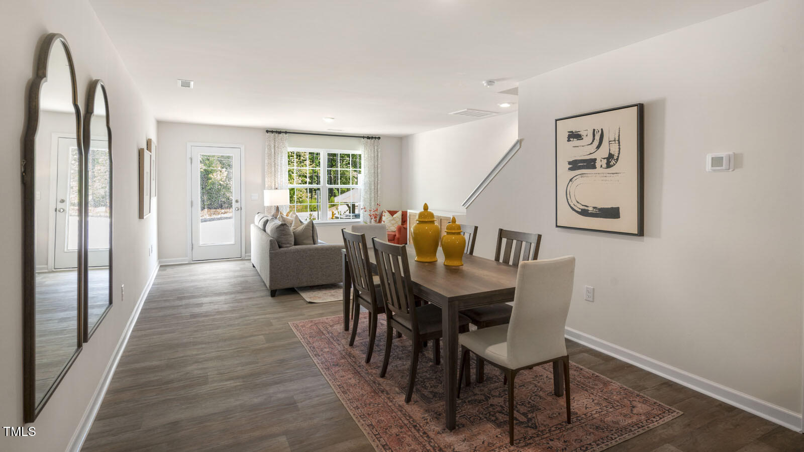8748 Asher Gray Way Raleigh, NC 27616 - Photo 14 of 33 a dining room with furniture and wooden floor