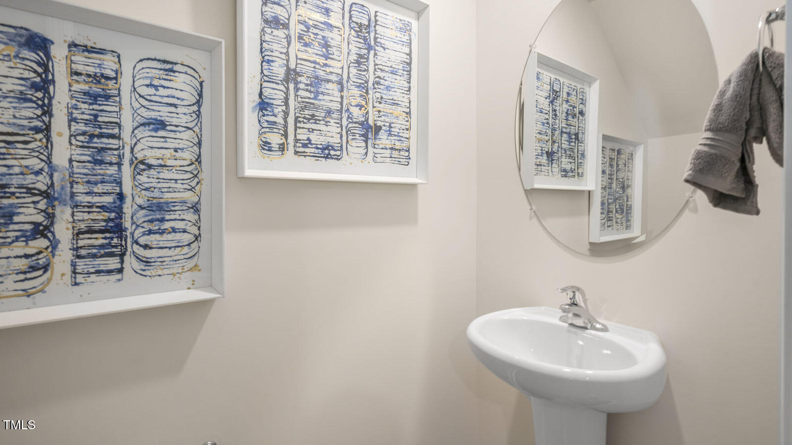 8748 Asher Gray Way Raleigh, NC 27616 - Photo 23 of 33 a bathroom with a sink and a mirror