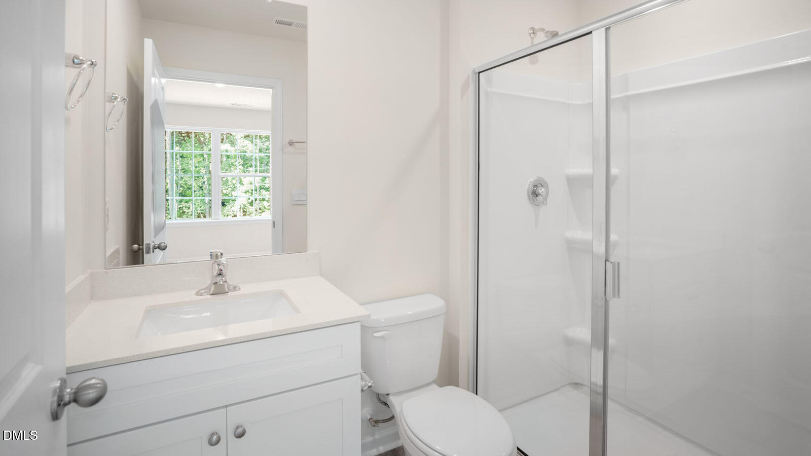 8748 Asher Gray Way Raleigh, NC 27616 - Photo 26 of 33 a bathroom with a sink toilet vanity and shower
