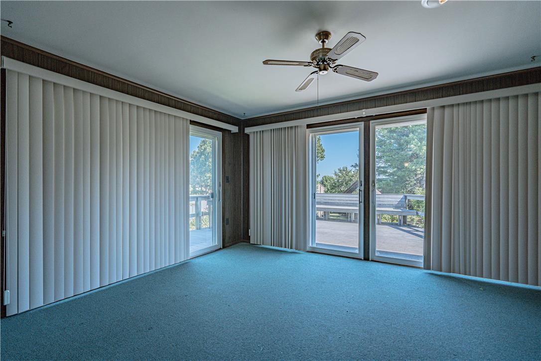 4815 Mill Road Schnecksville, PA 18078 - Photo 14 of 48 Step into a generously proportioned living space featuring multiple glass sliding doors that open to an outdoor deck.