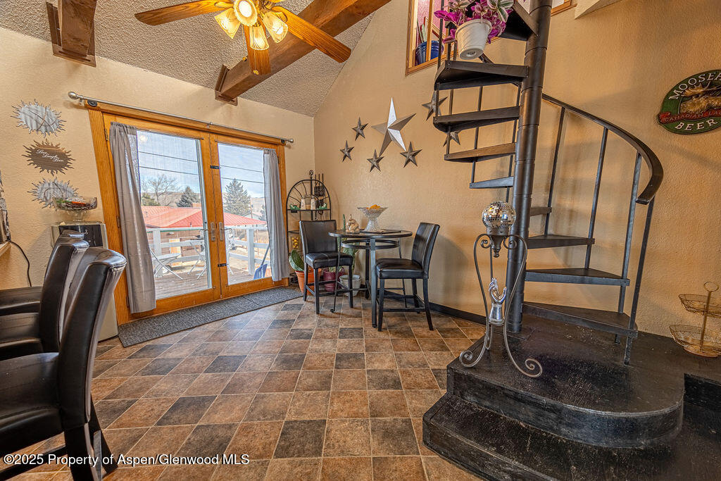 298 Middle Street Rangely, CO 81648 - Photo 12 of 75 a dining room with furniture and a floor to ceiling window