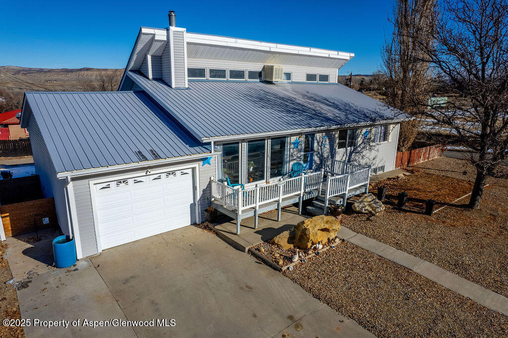 298 Middle Street Rangely, CO 81648 - Photo 3 of 75 a view of a house with a patio and wooden fence