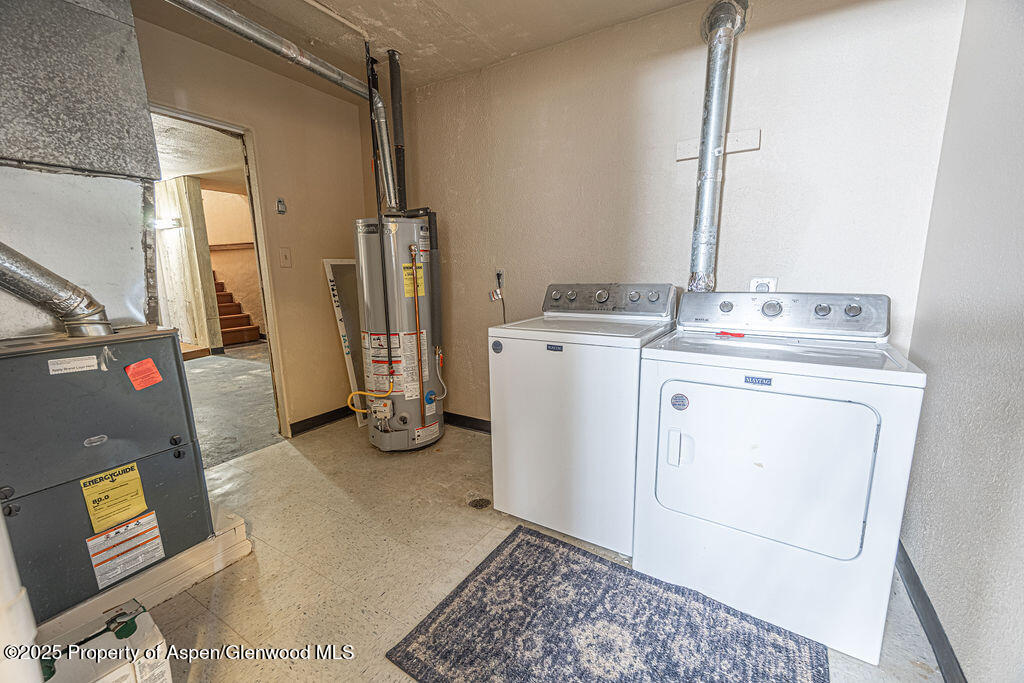 298 Middle Street Rangely, CO 81648 - Photo 35 of 75 a view of a storage and utility room with washer and dryer