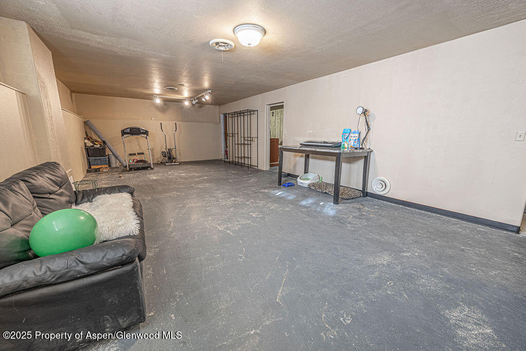 298 Middle Street Rangely, CO 81648 - Photo 42 of 75 a living room with furniture and a table