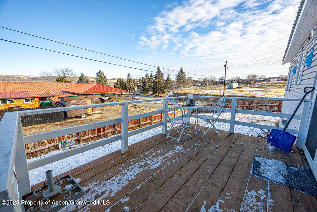 298 Middle Street Rangely, CO 81648 - Photo 58 of 75 a view of a balcony with wooden benches
