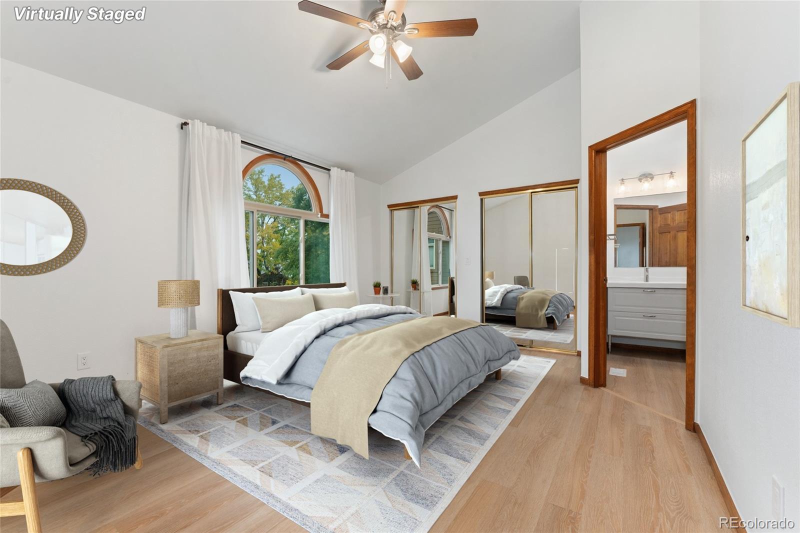 92 Ward Court Lakewood, CO 80228 - Photo 19 of 37 a bedroom with a bed and glass walk in closet