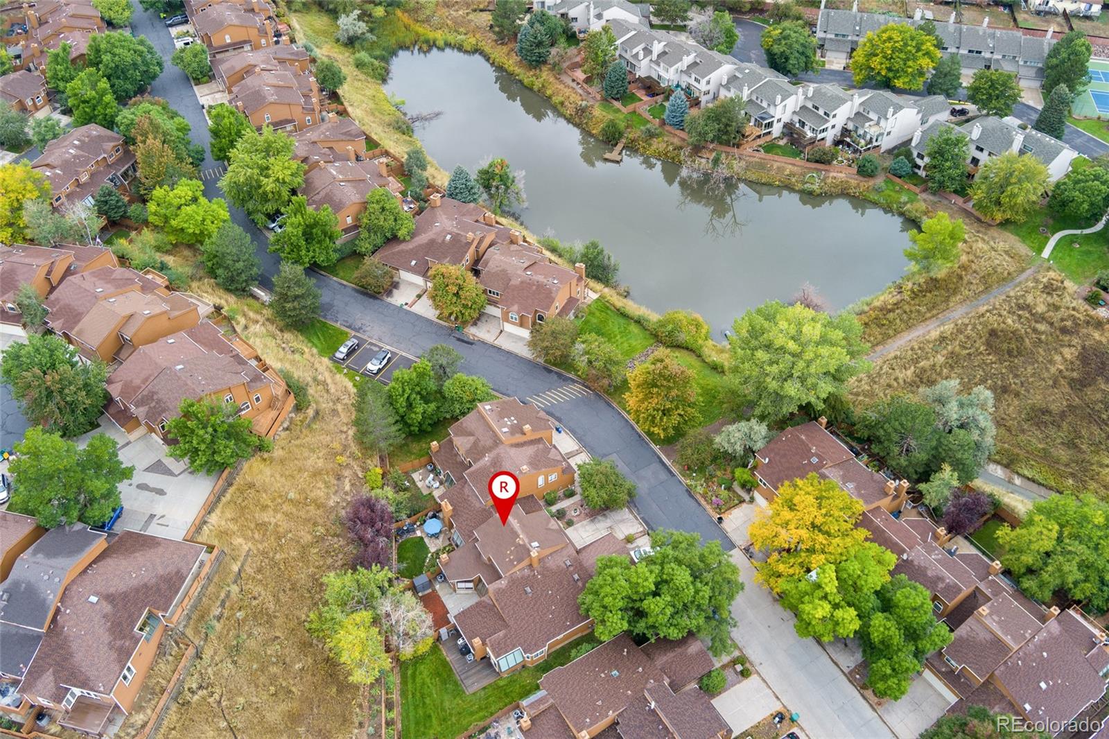 92 Ward Court Lakewood, CO 80228 - Photo 2 of 37 a view of a lake with a building in the background