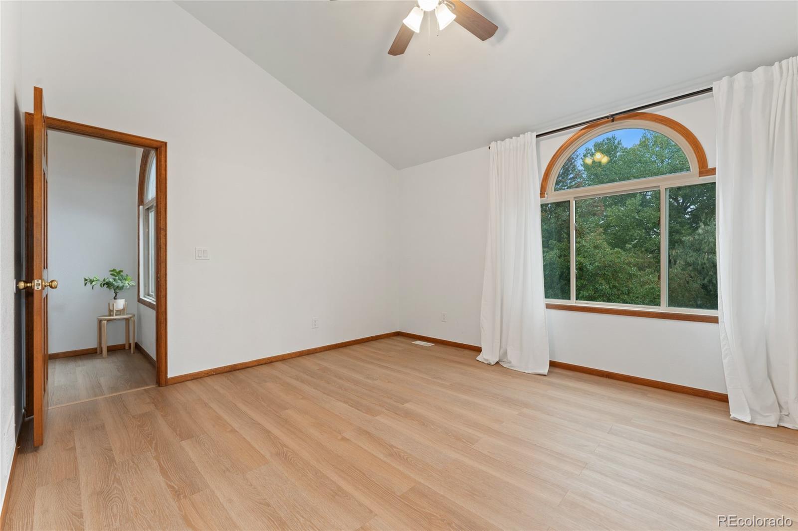 92 Ward Court Lakewood, CO 80228 - Photo 21 of 37 a view of an empty room with glass door and balcony