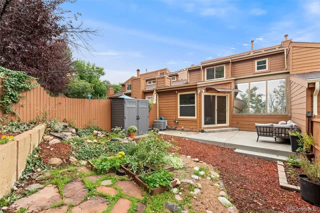 an aerial view of residential house with an outdoor space and street view