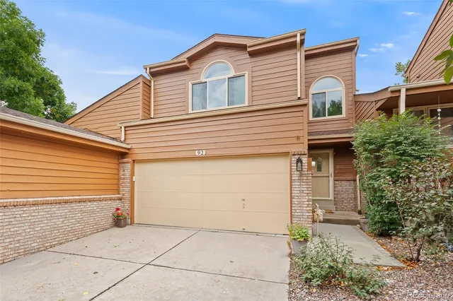 a front view of a house with a garage