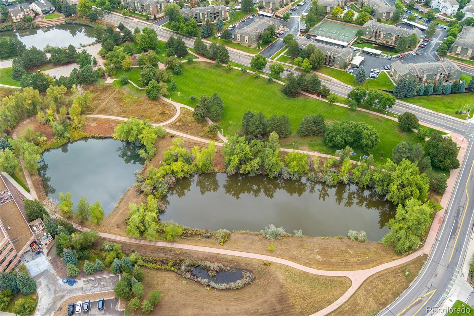 92 Ward Court Lakewood, CO 80228 - Photo 31 of 37 an aerial view of a house with a yard and lake view