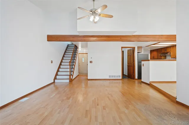 a view of an empty room with a fireplace