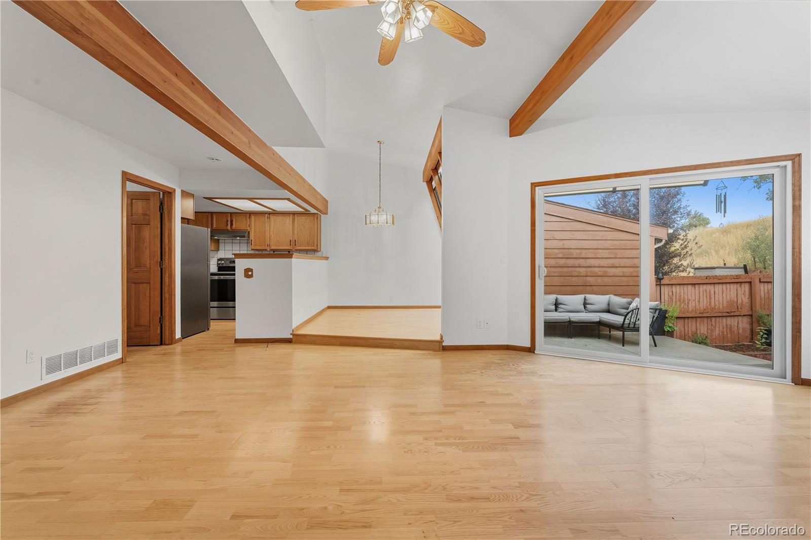 92 Ward Court Lakewood, CO 80228 - Photo 8 of 37 a view of an empty room with a fireplace