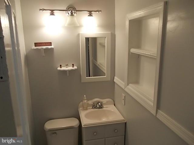1203 Edgewood Road Edgewood, MD 21040 - Photo 14 of 27 a bathroom with a sink toilet and shower