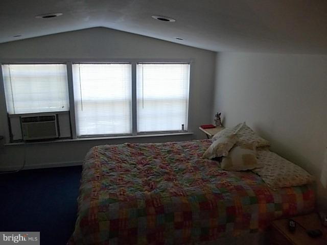 1203 Edgewood Road Edgewood, MD 21040 - Photo 19 of 27 a bed sitting in a bedroom next to a window
