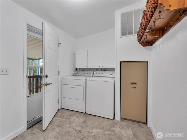 a kitchen with cabinets and white appliances