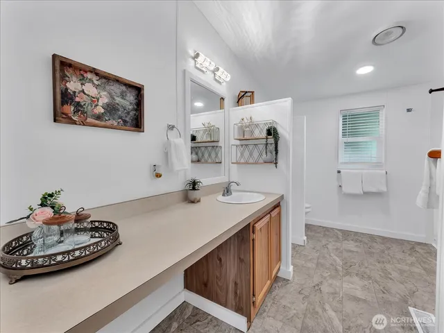 a kitchen with a sink and a stove