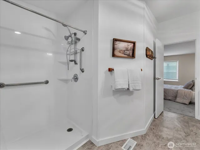 a bathroom with a bathtub and a shower