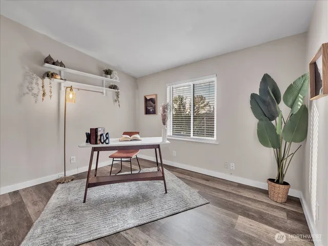 a view of a workspace with furniture