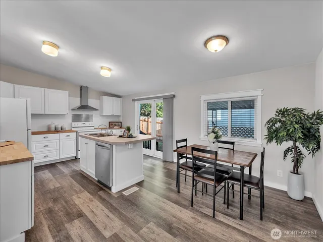 a kitchen with a table and chairs in it