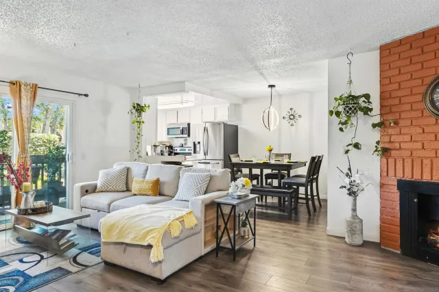 a view of a dining room with furniture and chandelier