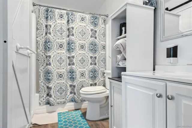 a bedroom with a bed and flat screen tv