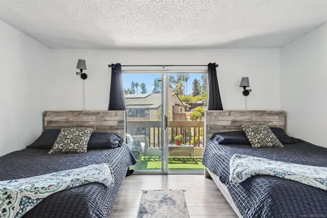 a bedroom with furniture and wooden floor