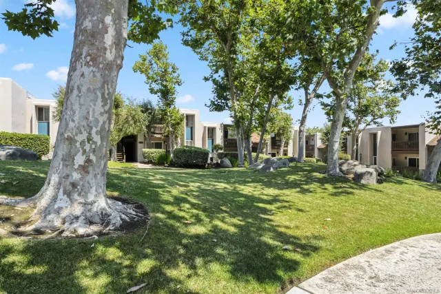a view of a balcony with chair and wooden floor