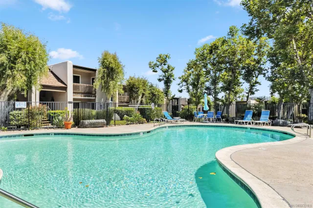 a living room with a sink and a washer dryer