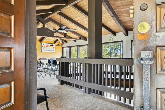 a view of a livingroom with furniture and a fireplace