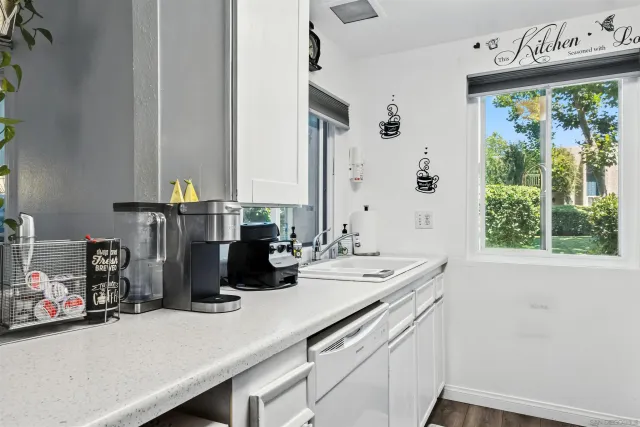 a kitchen with stainless steel appliances a refrigerator stove and microwave