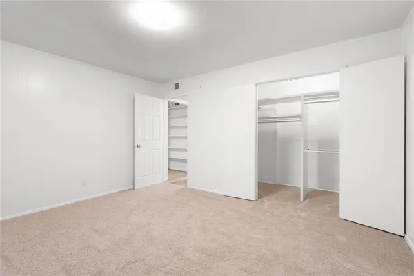 a view of an empty walk in closet