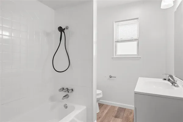 an empty room with closet and mirrors