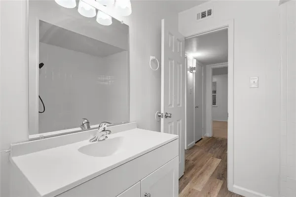 a view of an empty room and closet area