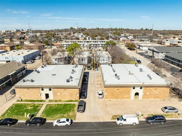 an aerial view of residential houses with outdoor space