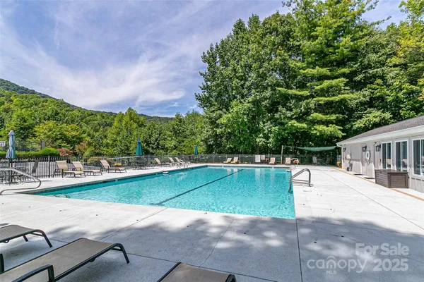 a view of a swimming pool with a patio