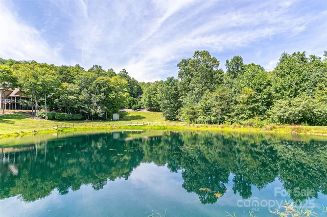 a view of a swimming pool with an outdoor space and seating area
