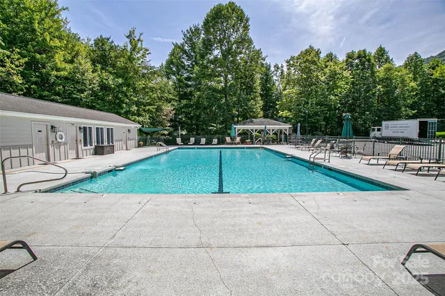 a view of a swimming pool with a patio