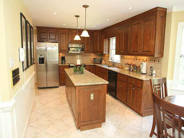 5024 Trail Ridge Drive Raleigh, NC 27613 - Photo 8 of 25 Gorgeous and completely remodeled! Granite counters, stainless appliances, island and tile Kitchen