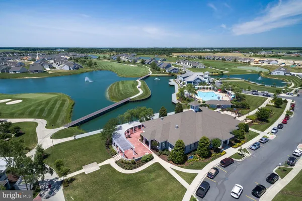 an aerial view of a house with a lake view