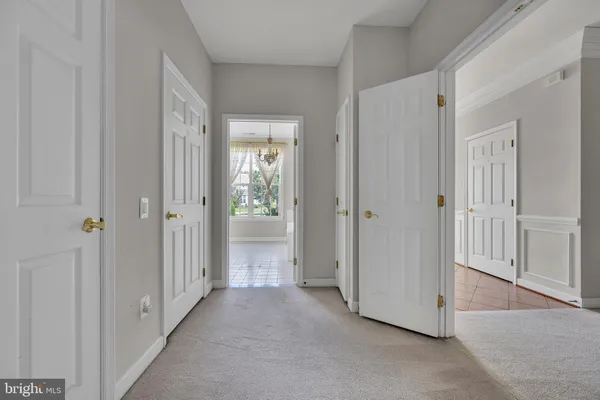 a view of a hallway with closet area
