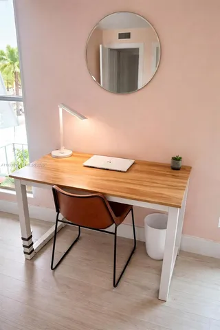 a view of a workspace with furniture