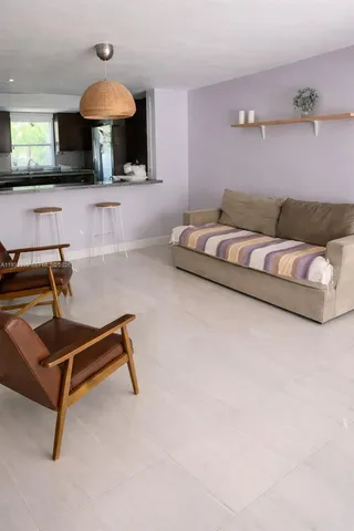 a living room with furniture and a table