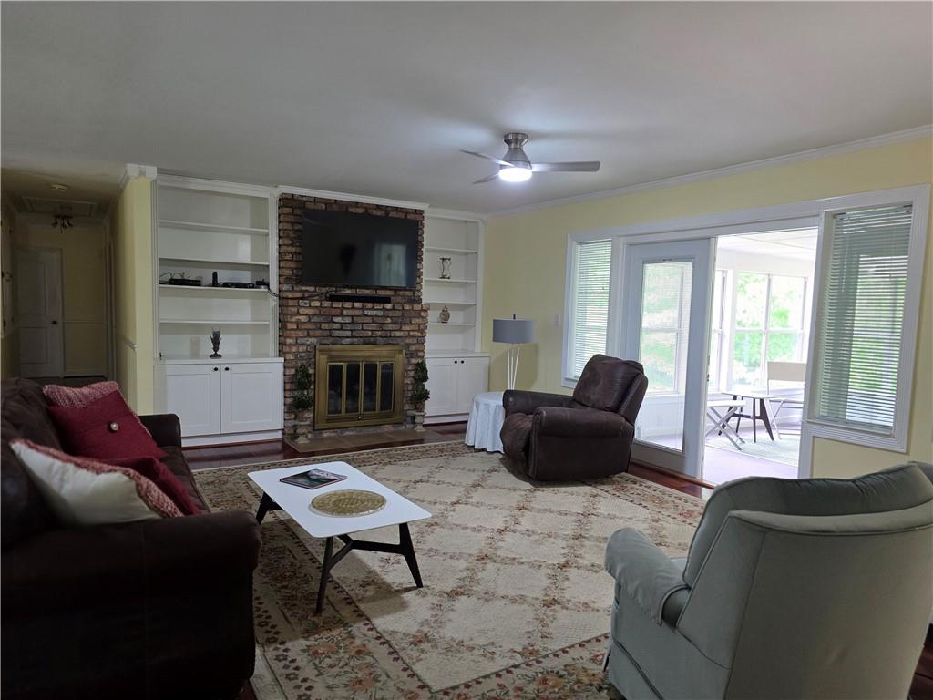 1554 Cooper Lake Road Southeast Smyrna, GA 30082 - Photo 14 of 49 a living room with furniture fireplace and a flat screen tv