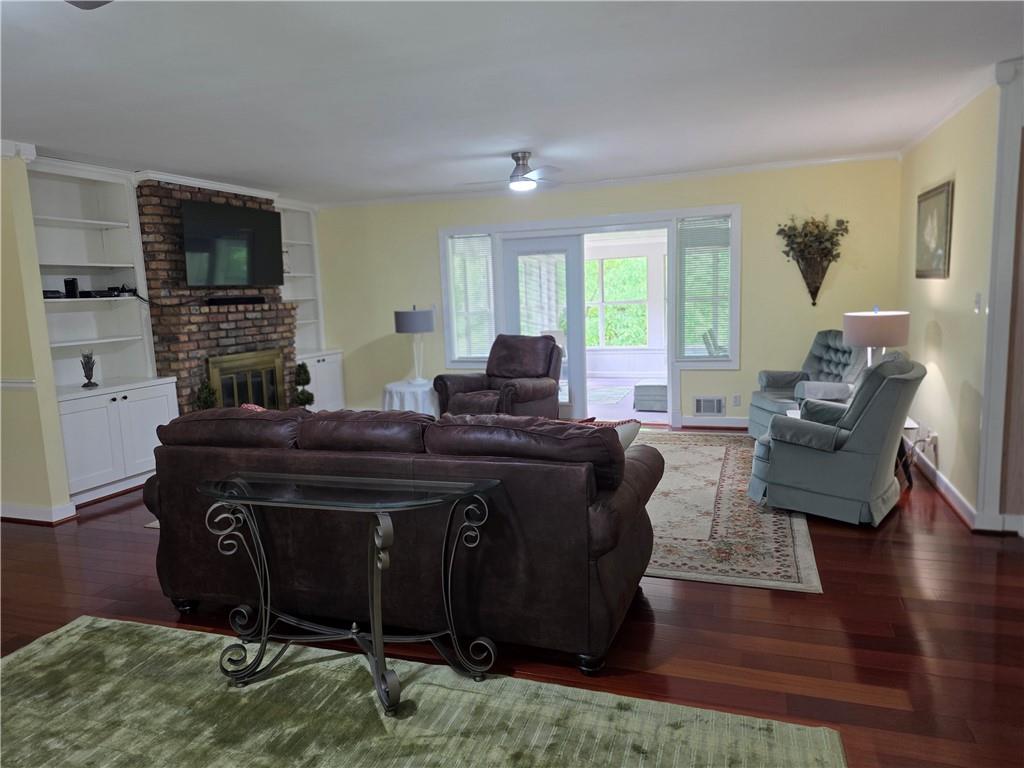 1554 Cooper Lake Road Southeast Smyrna, GA 30082 - Photo 15 of 49 a living room with a couch and a flat screen tv