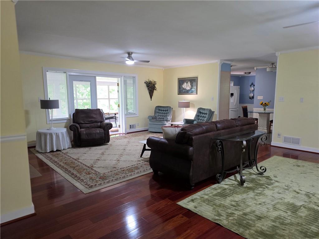 1554 Cooper Lake Road Southeast Smyrna, GA 30082 - Photo 16 of 49 a living room with furniture and wooden floor