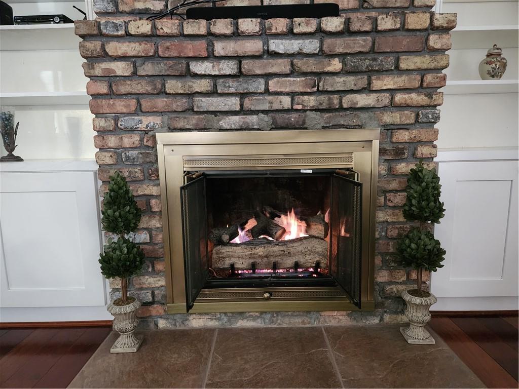 1554 Cooper Lake Road Southeast Smyrna, GA 30082 - Photo 18 of 49 a living room with a fireplace